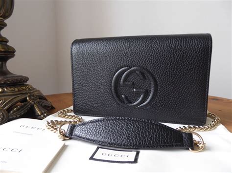 gucci black soho clutch|gucci embossed gray clutch wallet.